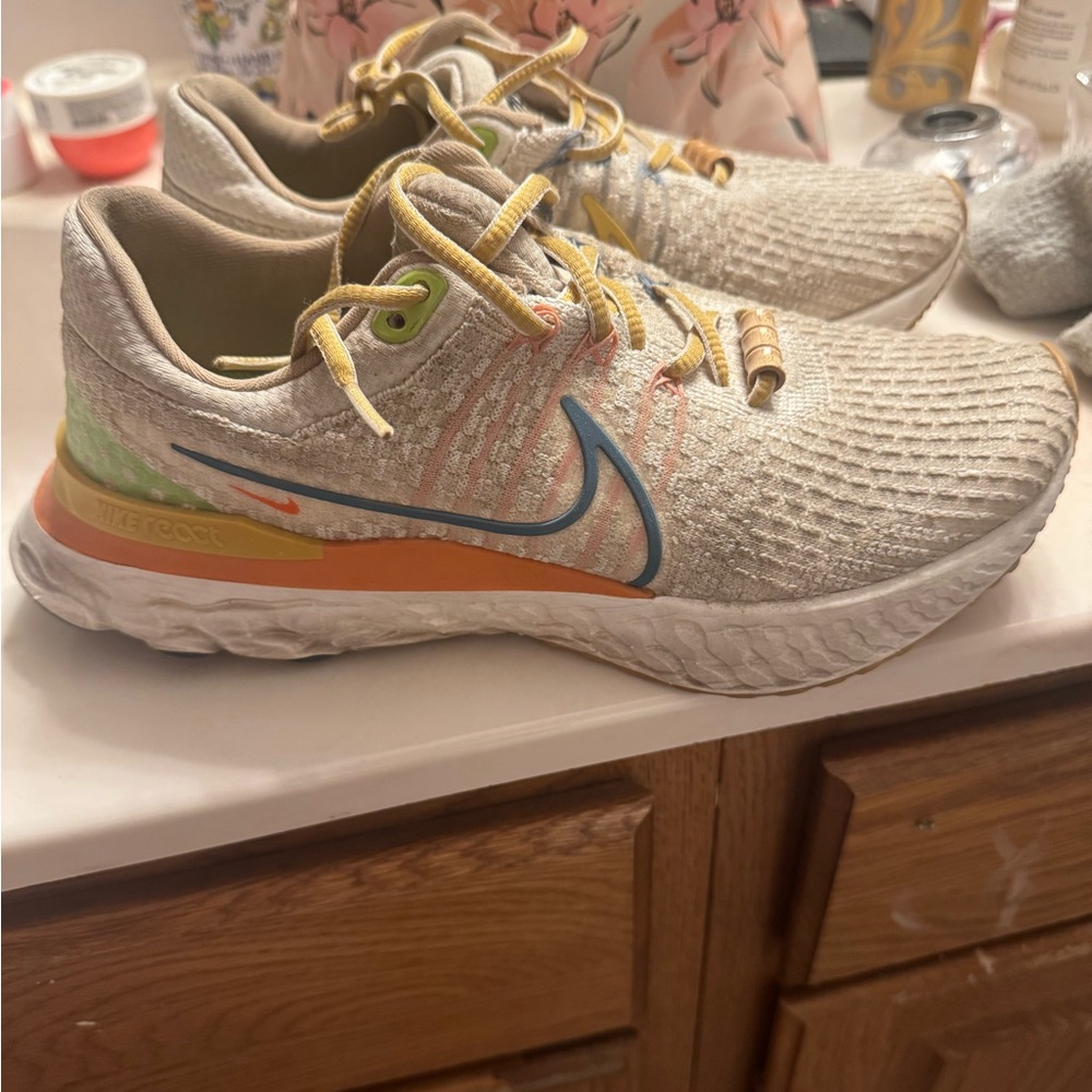 Nike Athletic Shoes - Beige, Orange, and Blue